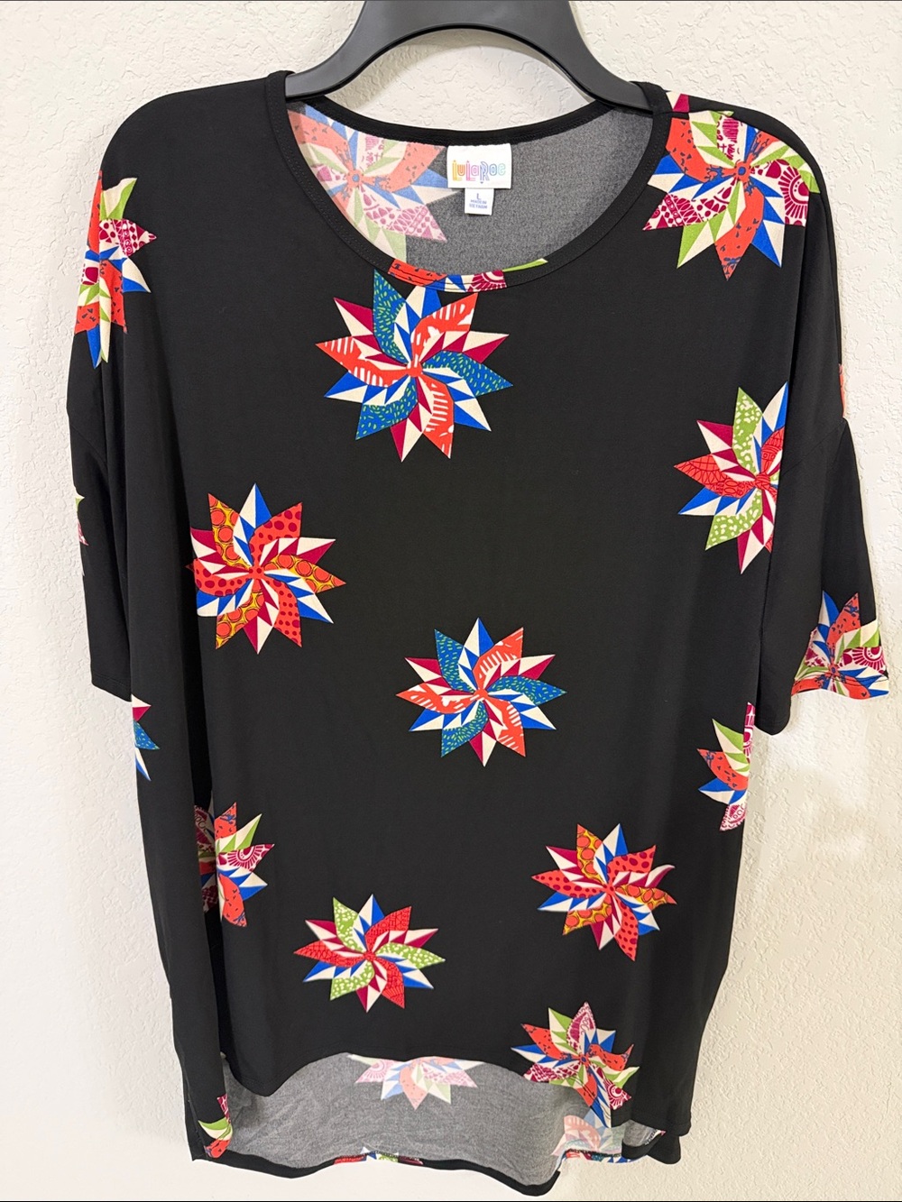 LuLaRoe Black Tunic Tee with Colorful Starburst print